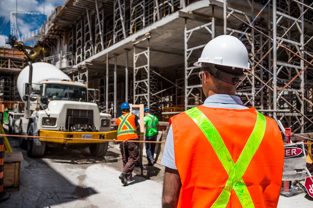 construction engineer walking towards a building